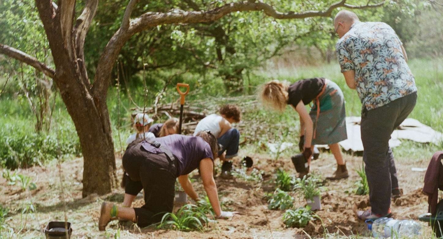 Community members working in the garden at MOST farm